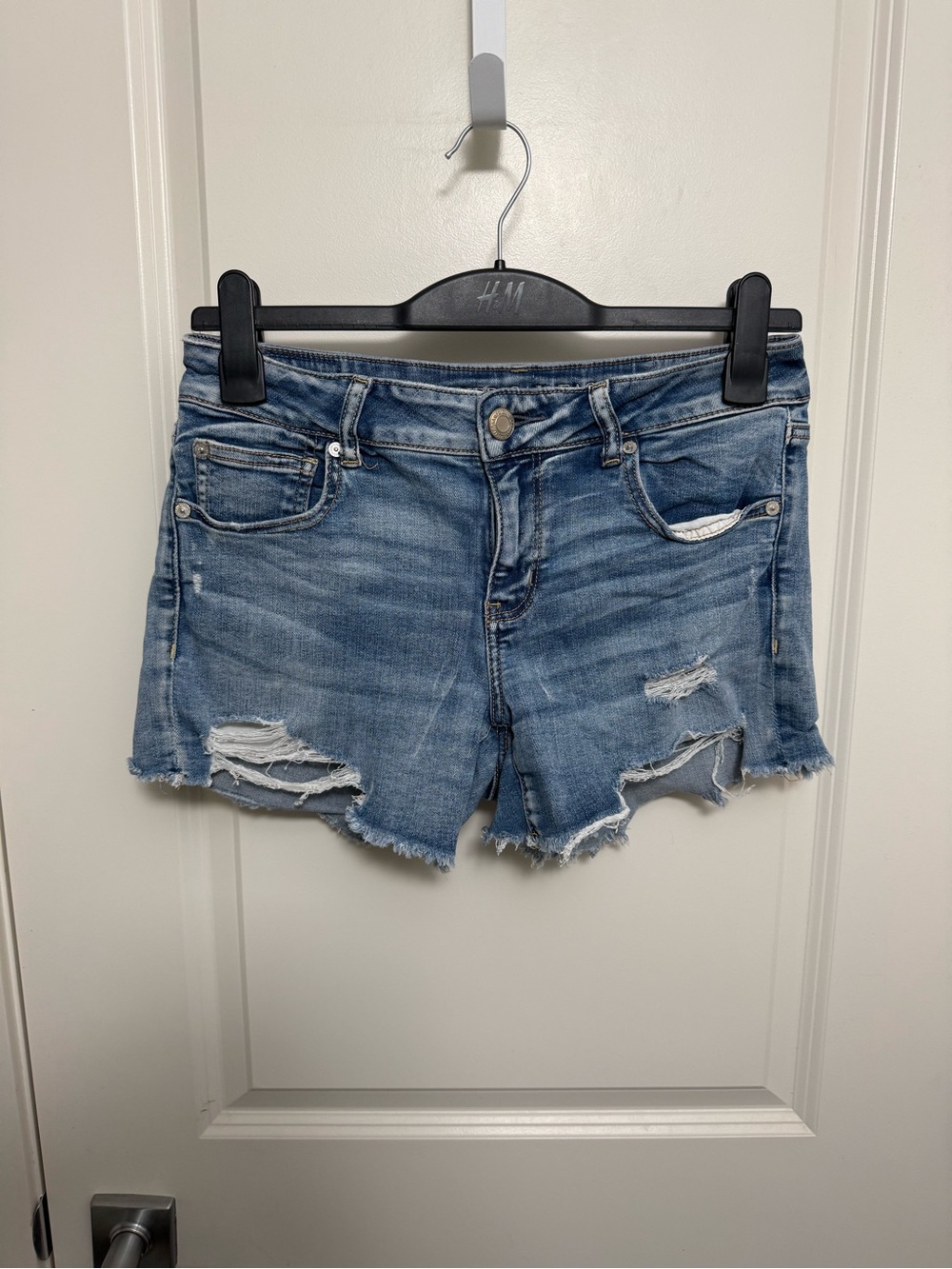 American Eagle Women's Light Blue Distressed Denim Shorts in size 10
